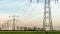 Electricity pylons in field
